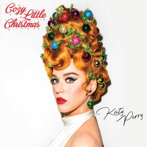 Katy Perry with red hair styled like a Christmas tree decorated with ornaments.