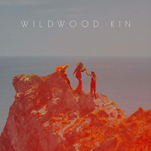 Album cover for Wildwood Kin, showing three figures on a red cliff.