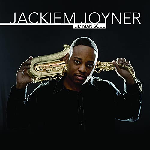 Jackiem Joyner holds a saxophone on the album cover "Lil Man Soul".