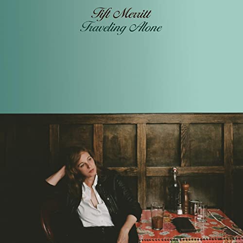 Album cover for Tift Merritt’s “Traveling Alone” featuring a woman seated indoors.