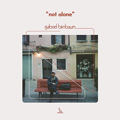 Album cover: man on a bench with buildings in the background.