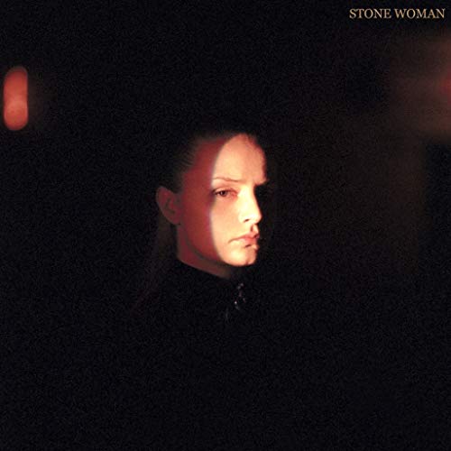 Close-up portrait of Charlotte Day Wilson in shadow, album cover.