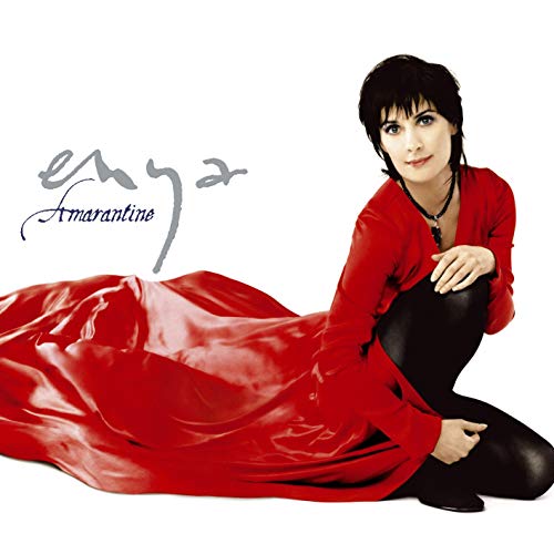 Enya album cover: artist in red, kneeling with flowing fabric.