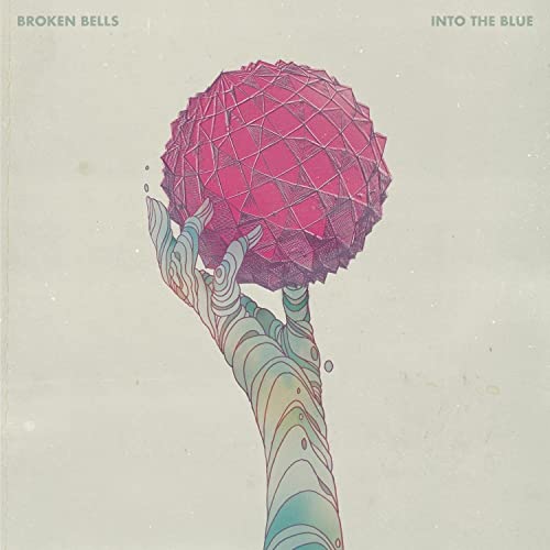 Album cover: hand holding a faceted, pink sphere against a pale background.