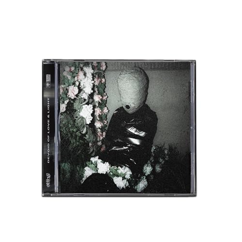 CD case with a figure in a mask surrounded by flowers.