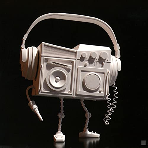 White boombox with headphones as a head, standing on legs.