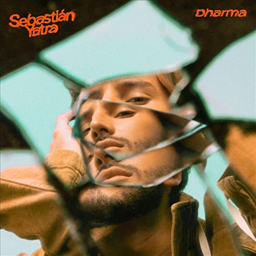 Album cover for Sebastián Yatra’s “Dharma” featuring a man and mirrors.