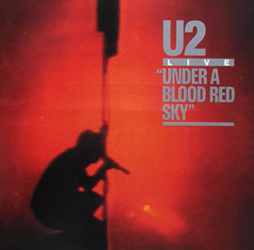 CD case with U2 album artwork, likely featuring dark or red sky imagery.