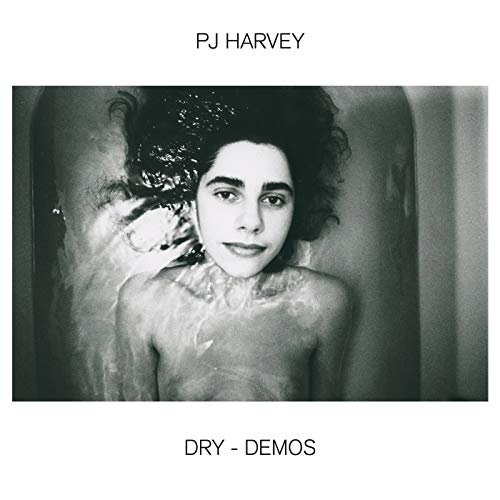 Black and white album cover featuring PJ Harvey submerged in water.