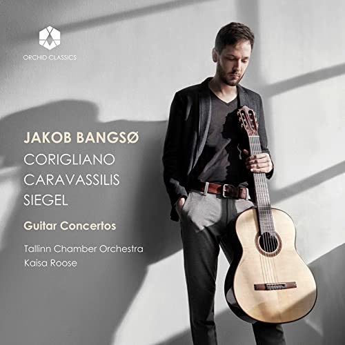 Jakob Bangsø standing against a wall holding a classical guitar, with album text overlay.