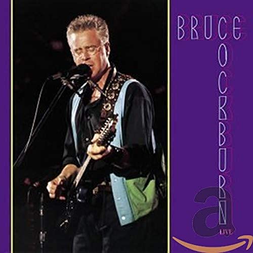 Bruce Cockburn playing guitar at a microphone, album cover art.