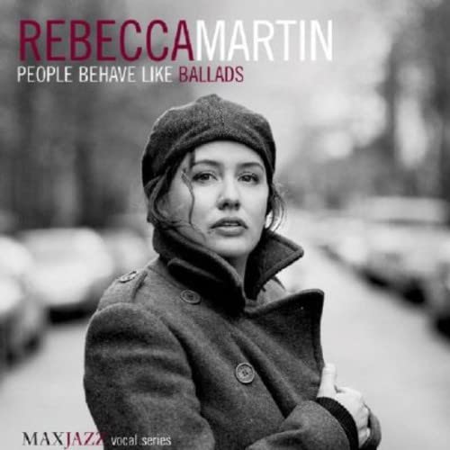 Rebecca Martin album cover, woman in a dark coat and knit hat.
