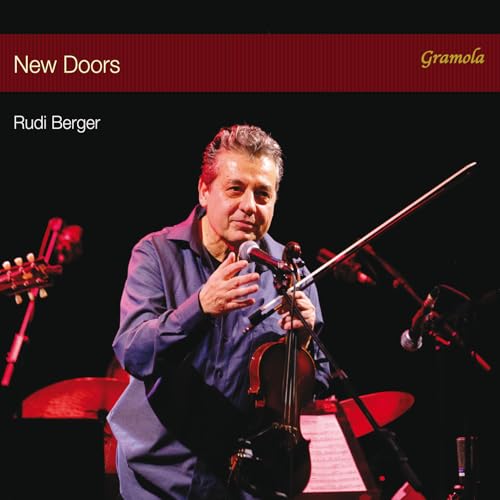 CD cover featuring a man playing the violin on stage.