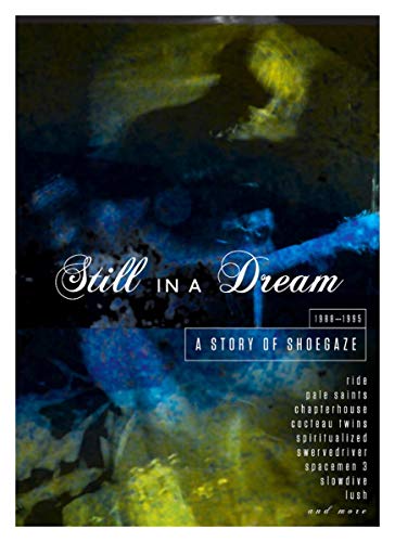 Album cover for Still In A Dream, featuring abstract blue and yellow textures.