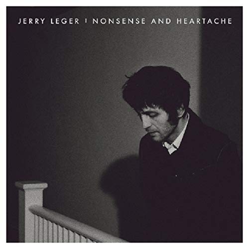 Black and white album cover featuring a man looking down a staircase.