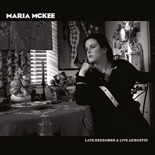 Maria McKee album cover: a woman sits thoughtfully in a decorated room.