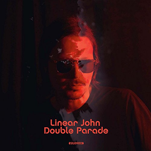 Red-toned album cover featuring a man in sunglasses, "Double Parade" text.