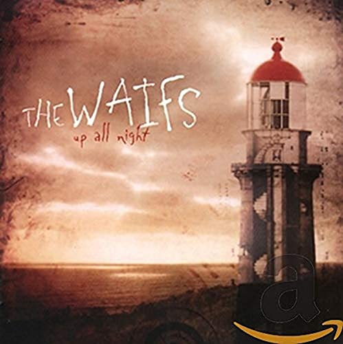 A lighthouse stands by the sea at sunset on this album cover.