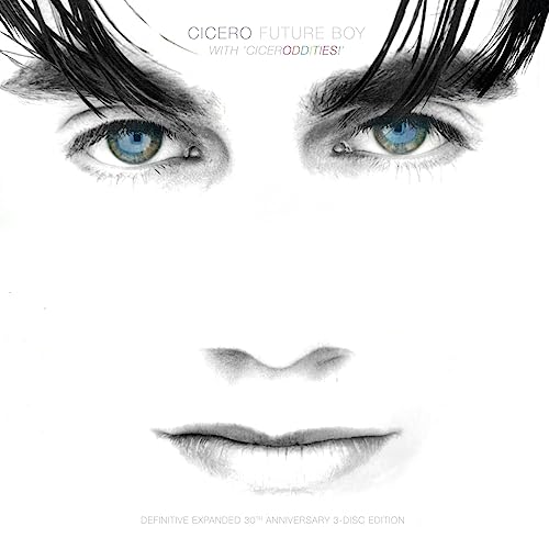 Close-up of a personβs face with striking blue eyes, album cover art.