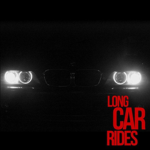 Dark image of a car’s headlights and grille with red text overlay.
