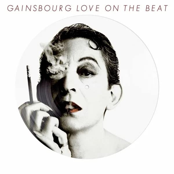 Black and white portrait of Serge Gainsbourg with cigarette smoke.