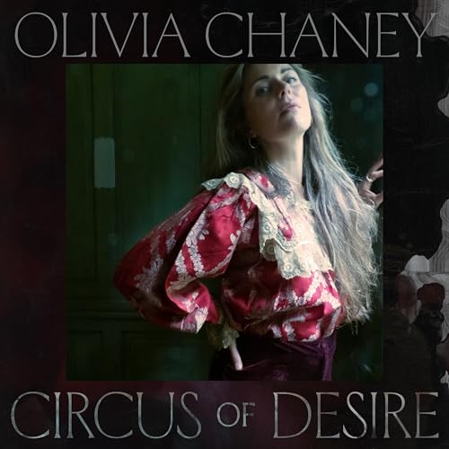 Olivia Chaney wearing a red patterned blouse with lace collar on a vinyl cover.