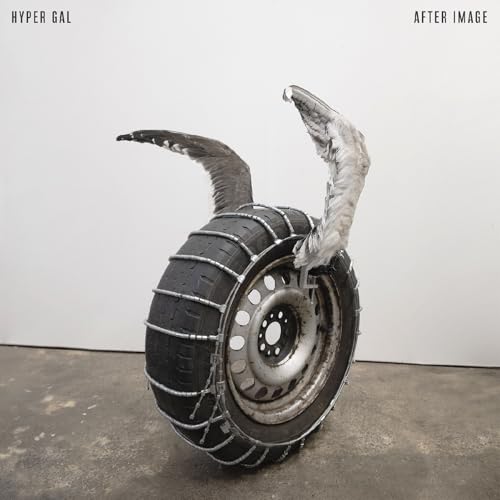 CD cover: a tire with a ghostly, swirling form emerging from it.