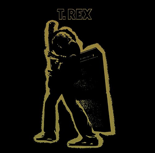Gold silhouette of a guitarist standing next to an amplifier on a black background.