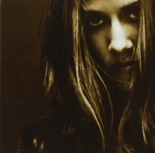 Close-up portrait of Sheryl Crow on a sepia-toned CD album cover.