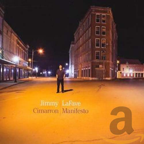 CD cover: Man standing on a street before a brick building.