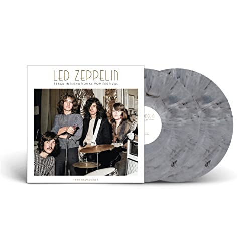 Grey vinyl record with black splatter, band photo on white album cover.