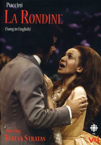 Opera scene with a man embracing a singing woman in costume.