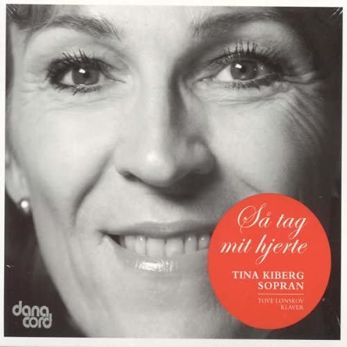 Close-up of a woman’s face with red circular album art overlay.