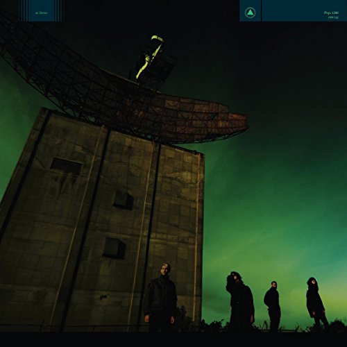 CD cover: large concrete tower with radar dish and four figures.