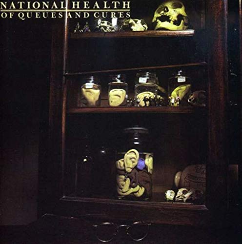 Dark wooden cabinet displaying preserved anatomical specimens in jars.