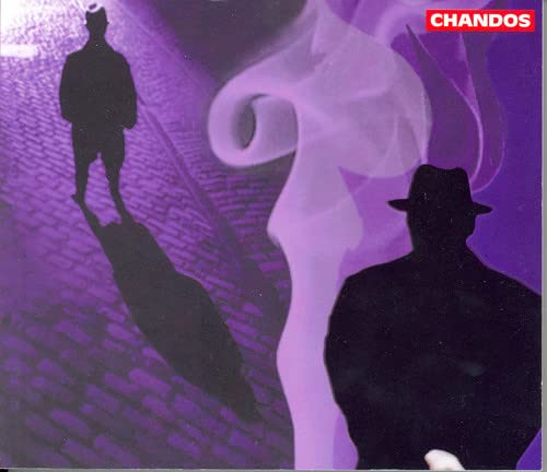 CD cover with silhouetted figures and purple smoky abstract design.