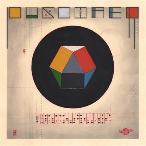 Puscifer album cover: geometric shapes within a black circle on beige.