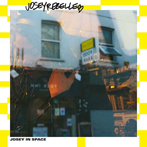 CD cover for Josey Rebelle’s “Josey in Space” with urban scene.
