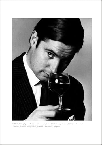 Black and white portrait of a man in a suit holding a wine glass.
