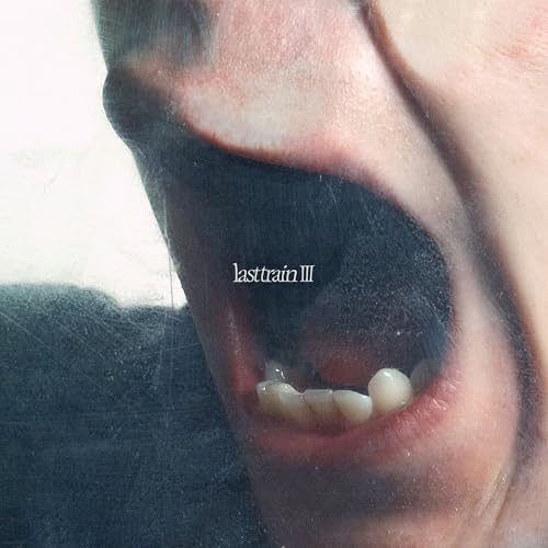 CD cover: close-up of an open mouth with text "lasttrain III".