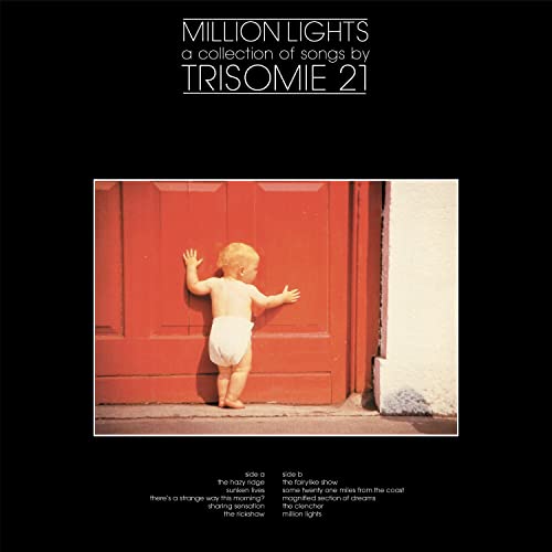 Album cover: baby in diaper facing red door, text “Million Lights” above.