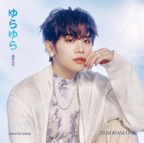 Zerobaseone Yura close-up portrait with blue and white background.