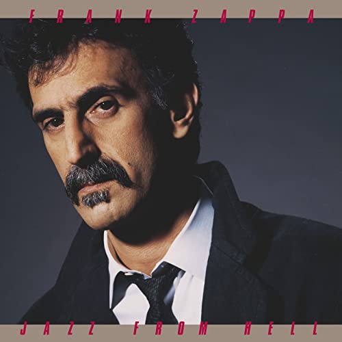 Frank Zappa album cover: portrait of musician with mustache, dark background.