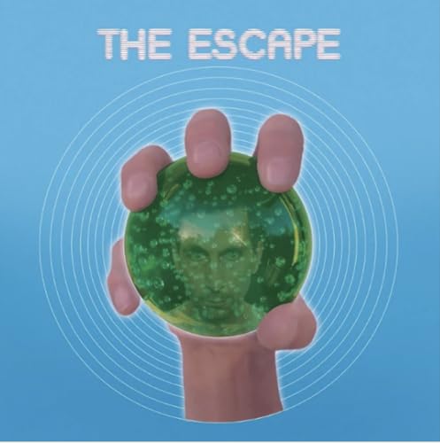 Hand holding a green sphere with a face inside, blue background.