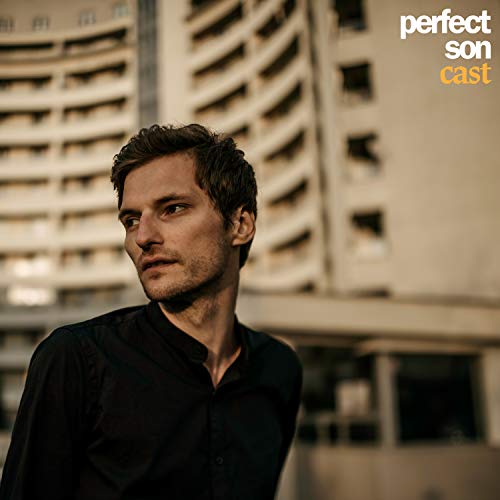 CD cover featuring a portrait of a young man against a building.