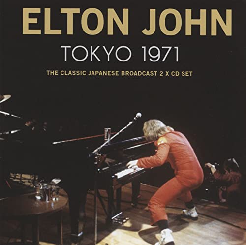 Elton John at a piano on stage, album cover for Tokyo 1971.