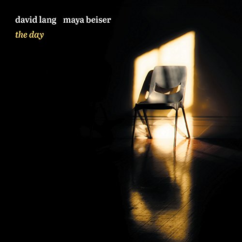 CD cover: empty chair illuminated by a strong beam of light.