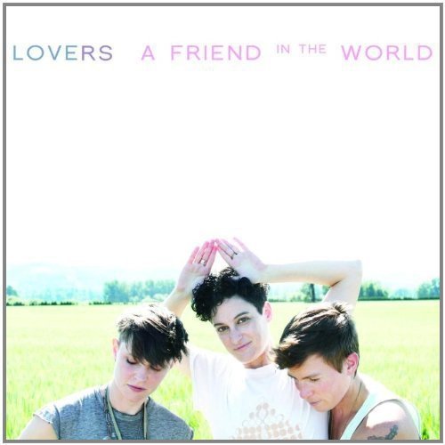 CD cover: three people in a field, heads together, looking at camera.