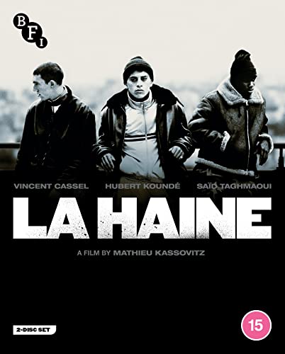 Black and white film cover featuring three men standing together with the title La Haine.