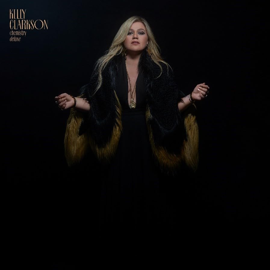 Kelly Clarkson album cover, "chemistry," featuring the artist in a fur coat.